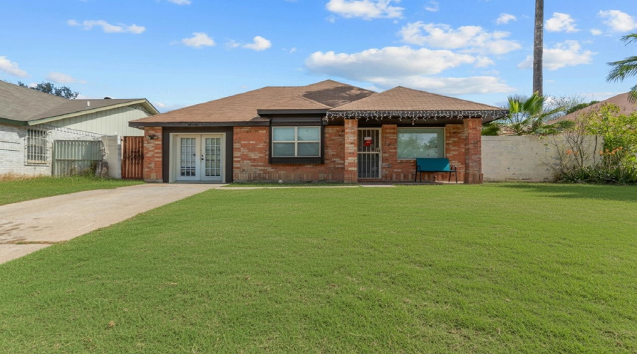 YARD HAS BEEN ENHANCED TO DISPLAY GREEN GRASS.