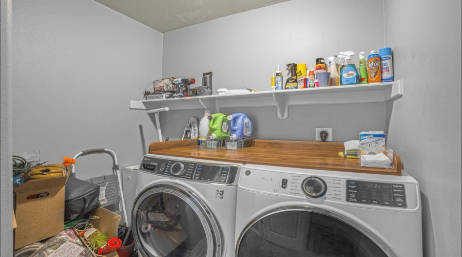 Located under the stairs, next to a half-bathroom for guests.