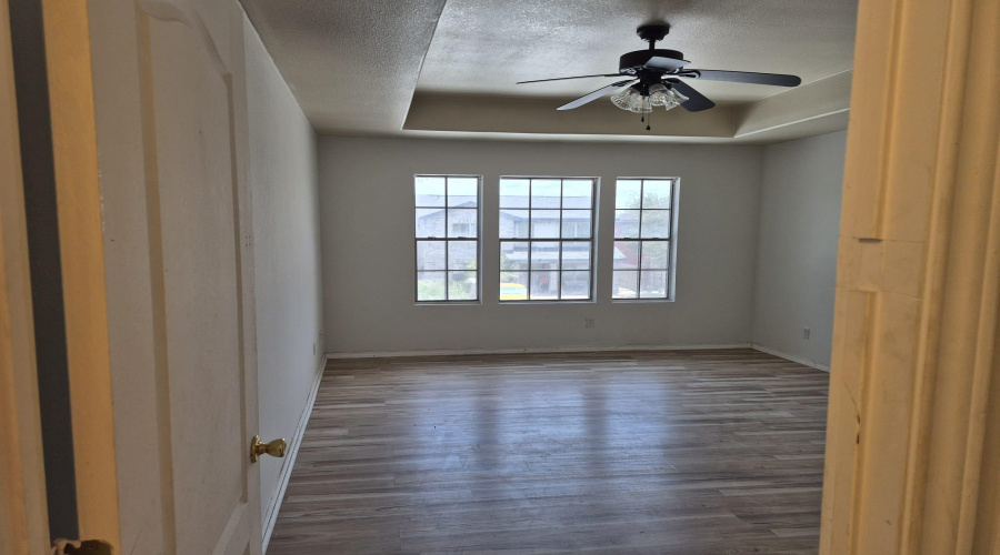 PRIMARY BEDROOM, WINDOWS FACE FRONT OF THE HOUSE