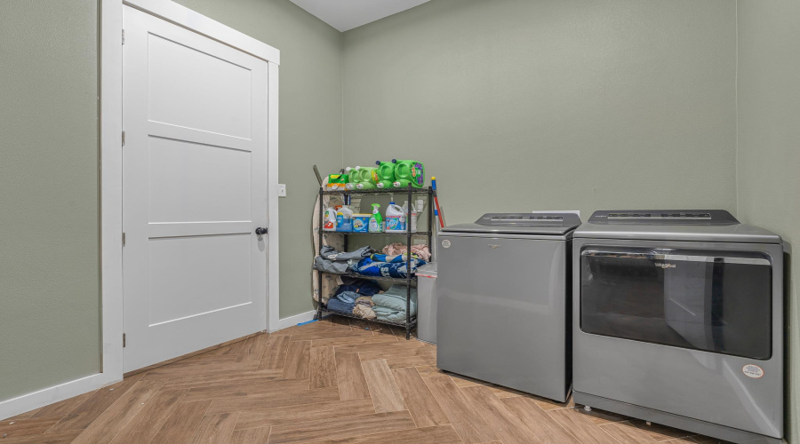 Laundry Room Off the Primary Suite and Mud Room Hall way.
