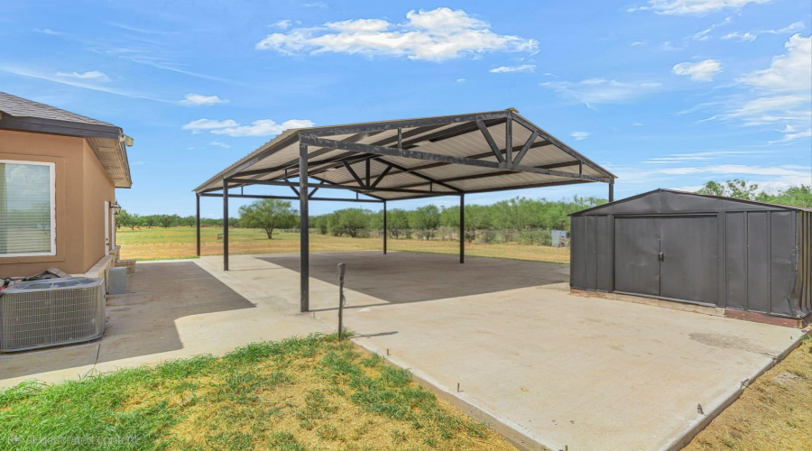 Carport Will cover approx 6 vehicles. Located right outside the mud room hall way into the house.