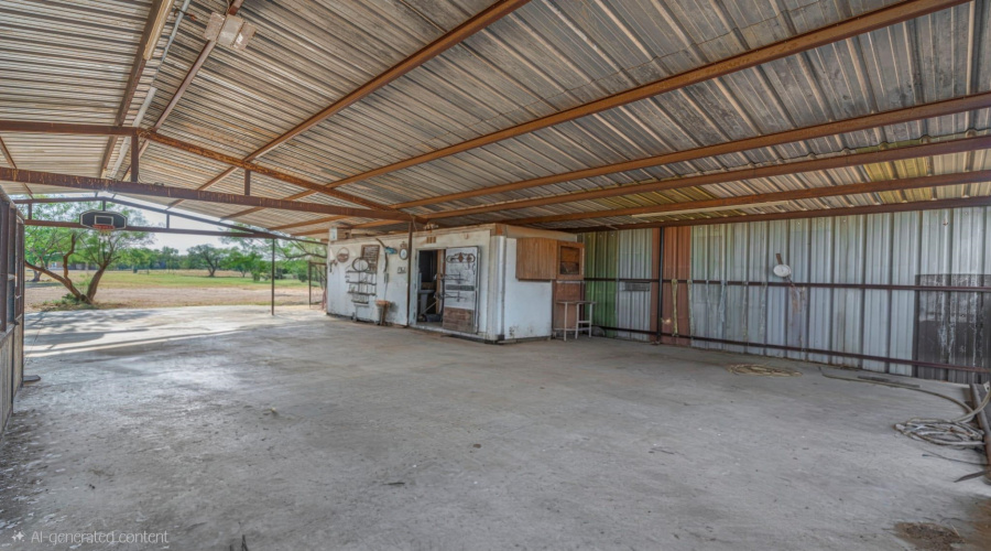 Corral area with stables, half bath, storage area and large covered area for parking or gatherings.